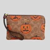 COACH Corner Zip Wristlet In Signature Canvas With Halloween Print Tan Multi CCL20