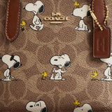 COACH Coach X Peanuts City Mini Tote Bag In Signature Canvas With Snoopy Print Tan/Brown Multi CBS83