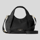 Black handbag with gold accents on a light gray background