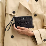 COACH Corner Zip Wristlet In Signature Leather With Heart Charm Silver/Black CDY96